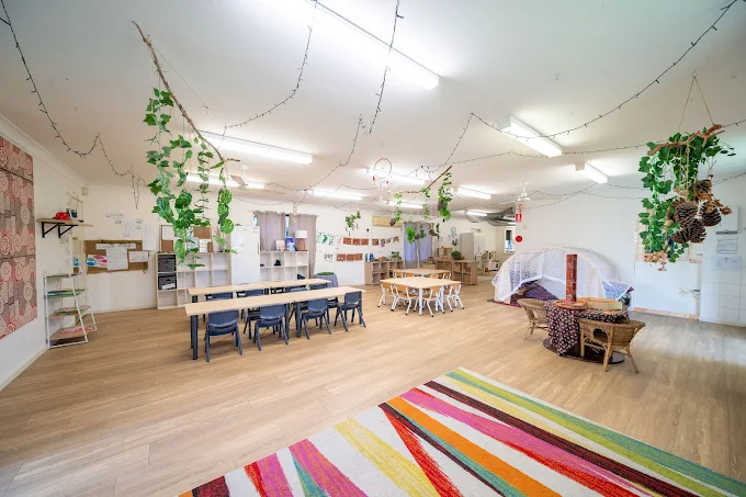 lakeside creative minds childcare interior with tables chairs and viberant colors